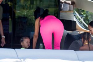 Kim Kardashian curves vintage hot pink Chanel onesie Miami boat trip. cute kids North and Saint, OG crew Jonathan Cheban and Larsa Pippen. Dave Grutman's 'Groot boat Larsa's daughter Sophia Pippen, ABC's Dancing With The Stars: Juniors.