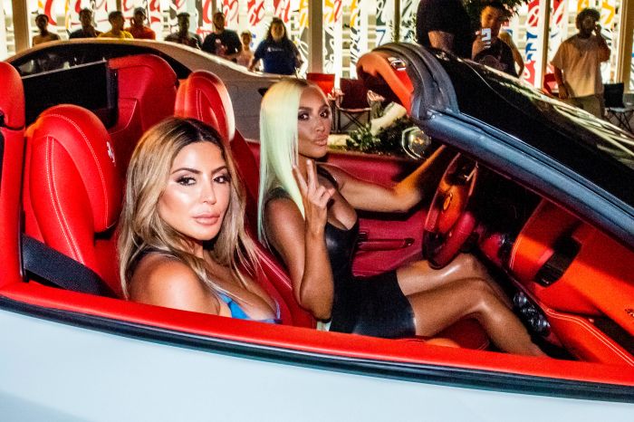 Kim Kardashian and Larsa Pippen drive convertible in Miami.