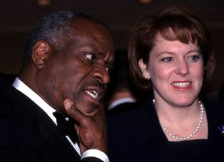 F365441 02: Supreme Court Justice Clarence Thomas and wife Virginia attend the American Enterprise Institute's annual dinner, February 15, 2000 in Washington, DC.