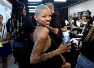BROOKLYN, NY - SEPTEMBER 12: Model Slick Woods poses backstage for the Savage X Fenty Fall/Winter 2018 fashion show during NYFW at the Brooklyn Navy Yard on September 12, 2018 in Brooklyn, NY.