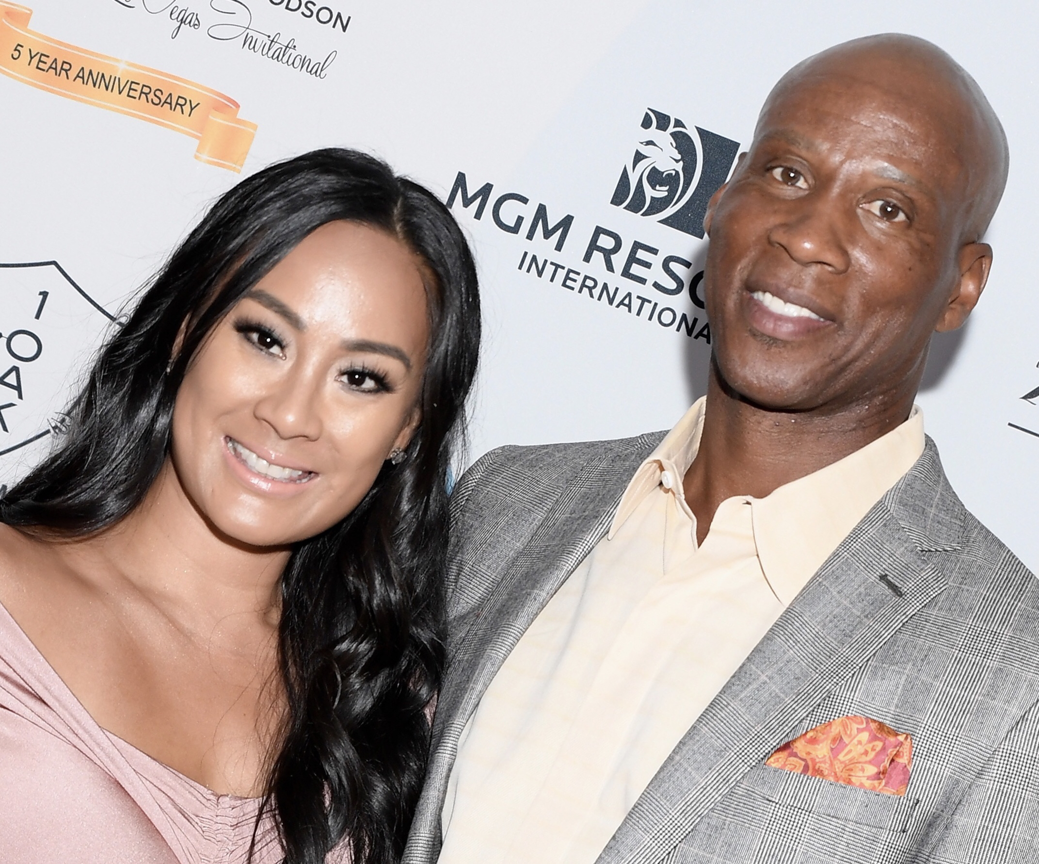 Cece Gutierrez (L) and former NBA player and coach Byron Scott get engaged.