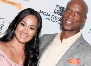 Cece Gutierrez (L) and former NBA player and coach Byron Scott get engaged.