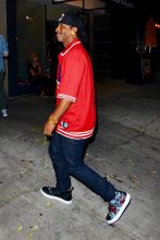 Katt Williams holds a trophy in hand as he leaves the Peppermint Club after attending Dave Chappelle's private event in Los Angeles, CA.