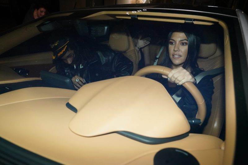 Kourtney Kardashian leaves Cross Roads Restaurant with Luka in a car in Los Angeles, CA.