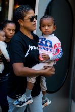 Kim Kardashian neon outfit children, North, Chicago and Saint West, in New York City, NY.