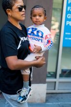 Kim Kardashian neon outfit children, North, Chicago and Saint West, in New York City, NY.