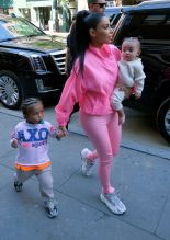 Kim Kardashian neon outfit children, North, Chicago and Saint West, in New York City, NY.