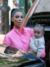 Kim Kardashian goes out in Soho with her daughter's, Chicago and North West, and her son Saint West in New York City, NY.