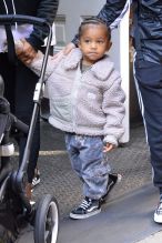 Saint West seen dancing outside the Mercer hotel while out with Chicago West and their nanny in SOHO NYC