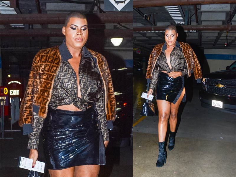 EJ Johnson wearing Fendi fur jacket and blouse with patent leather mini skirt and booties in Los Angeles, CA.