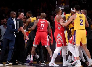 LOS ANGELES, CA - OCTOBER 20: Chris Paul #3 of the Houston Rockets is restrained by LeBron James #23 of the Los Angeles Lakers after a fight involving Rajon Rondo #9 and Brandon Ingram #14 of the Los Angeles Lakers during a 124-1115 Rockets win at Staples Center on October 20, 2018 in Los Angeles, California.