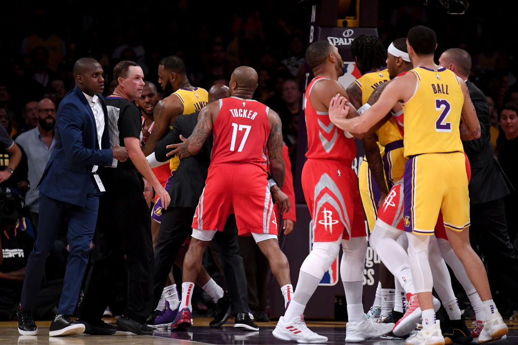 LOS ANGELES, CA - OCTOBER 20:  Chris Paul #3 of the Houston Rockets is restrained by LeBron James #23 of the Los Angeles Lakers after a fight involving Rajon Rondo #9 and Brandon Ingram #14 of the Los Angeles Lakers during a 124-1115 Rockets win at Staples Center on October 20, 2018 in Los Angeles, California.