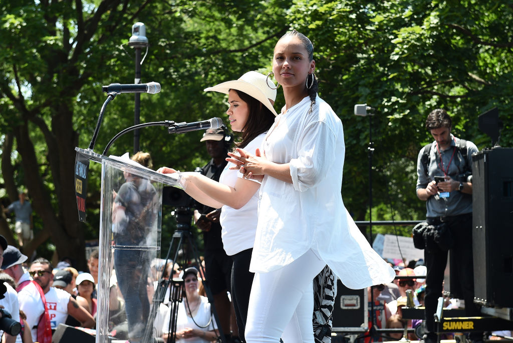 WASHINGTON, DC - JUNE 30:  Alicia Keys and America Ferrera speak during Families Belong Together Rally In Washington DC Sponsored By MoveOn, National Domestic Workers Alliance, And Hundreds Of Allies on June 30, 2018 in Washington, DC. 