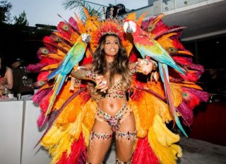 Asiah Collins wears carnival caribana costume for 30th birthday
