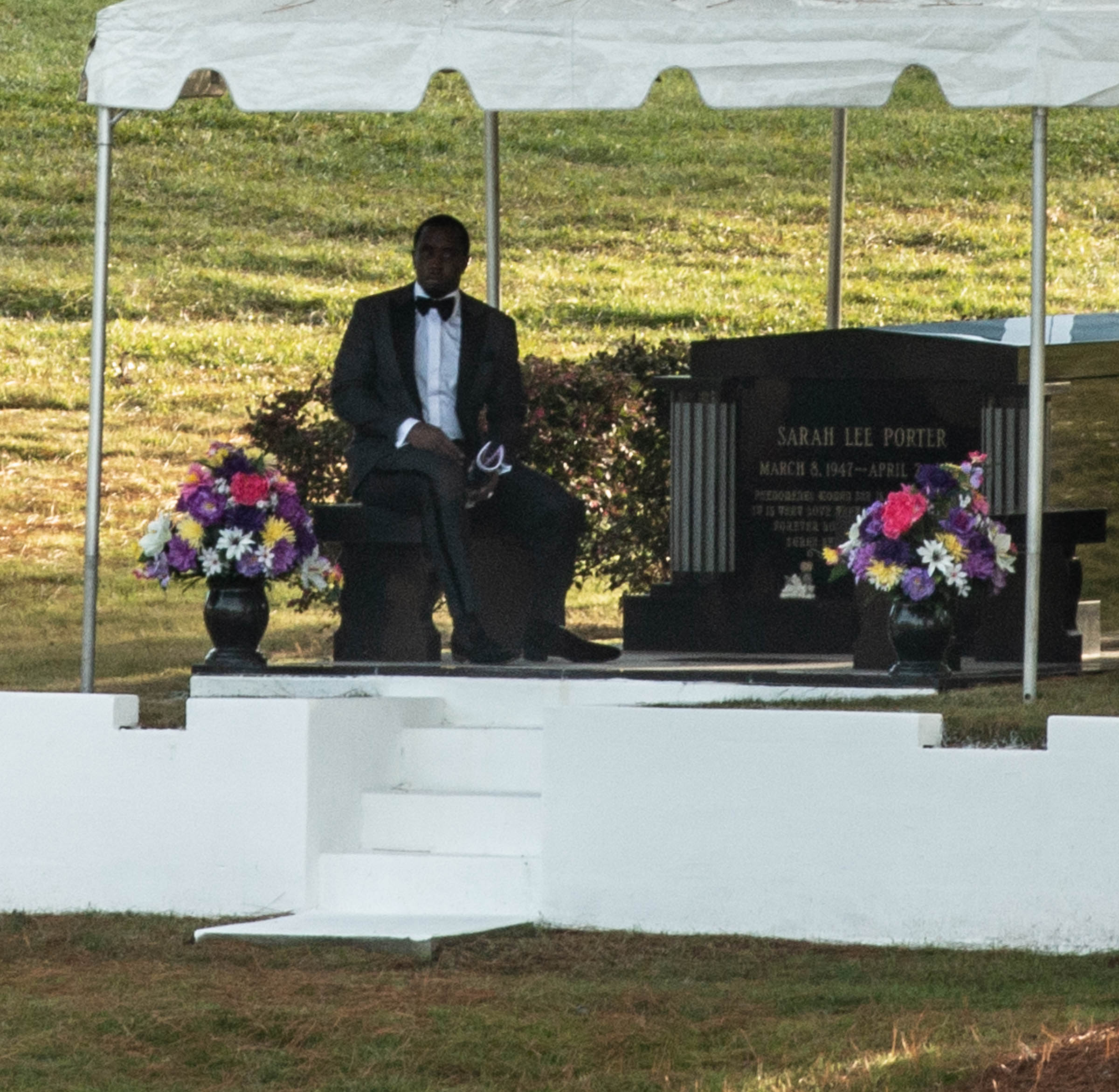 Diddy Mourns At Kim Porter's Gravesite