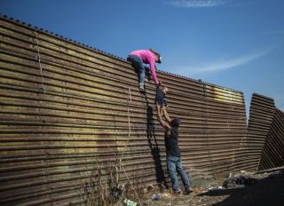 Migrants Attempt To Cross U.S. Border