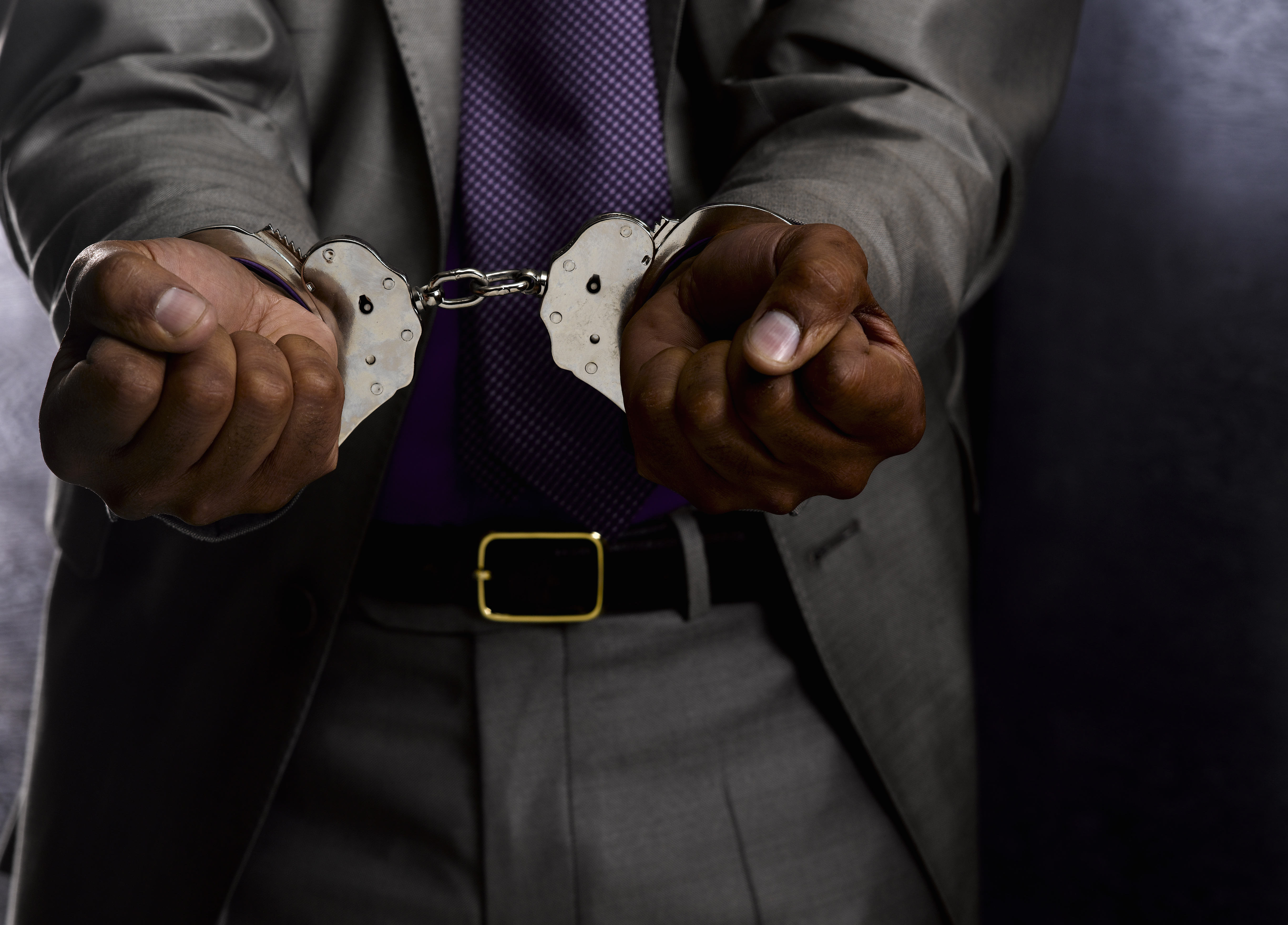 Business man in handcuffs