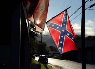 guy gets fired for wearing confederate flag and noose to polls