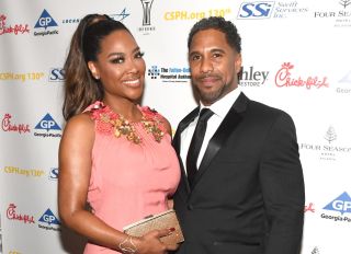 ATLANTA, GA - MARCH 24: TV personality Kenya Moore and Marc Daly attend Carrie Steele-Pitts Home 130th Anniversary Gala at Four Seasons Hotel on March 24, 2018 in Atlanta, Georgia.