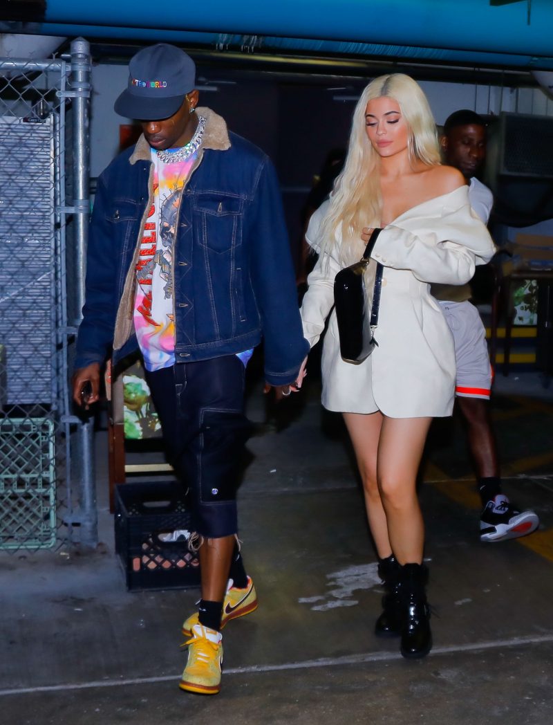 Kylie Jenner is all smiles as she exits the Nobu restaurant holding hands with her boyfriend Travis Scott on their date night during a break in the tour as the arrived into Miami Beach. Kylie was wearing a fashionable cream look as Travis was wearing some looks from his tour, Astroworld.