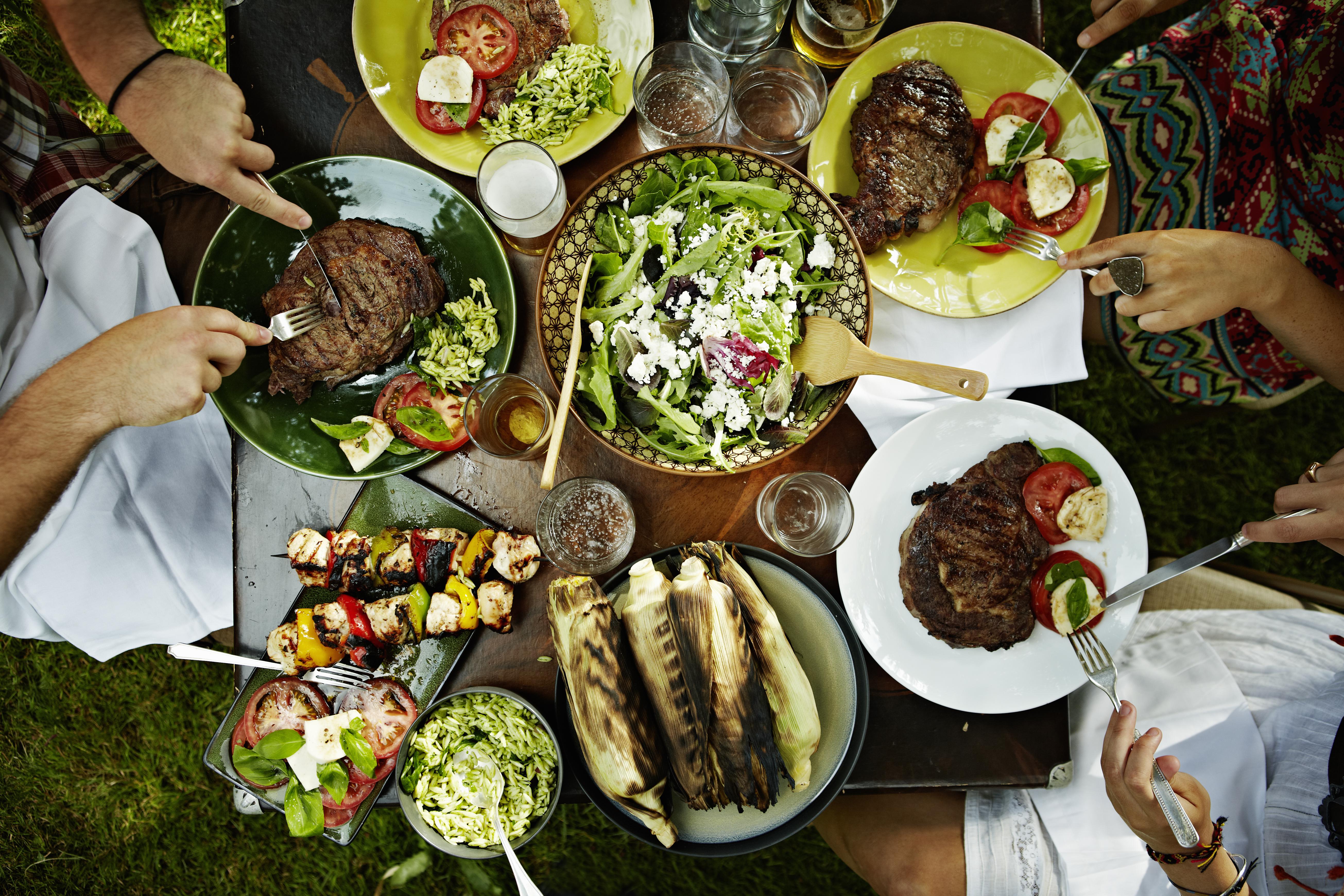 Overhead view of friends dining at table outdoors