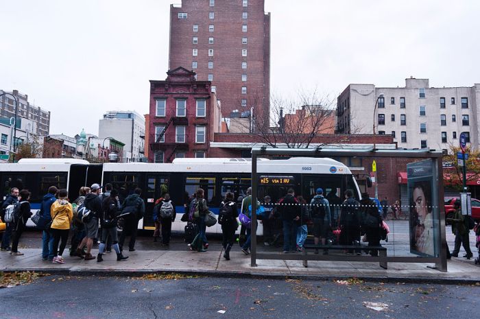 Passengers getting on MTA bus
