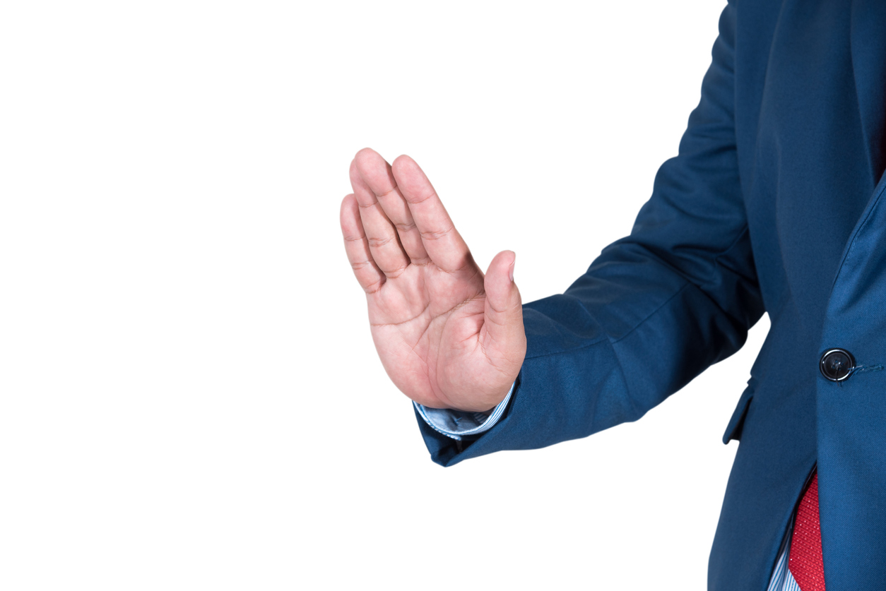 Cropped Image Of Businessman Showing Stop Gesture Against White Background