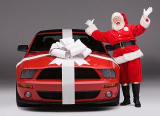 Santa Claus Delivering New Ford Mustang Convertible