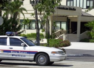 A Boca Raton police car blocks the entra