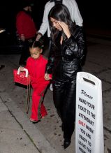 North West wears red Fendi sweatsuit to dinner with mom Kris Jenner Kourtney Kardashian and Corey Gamble