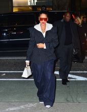 Rihanna wears pinstriped blazer with white hoodie