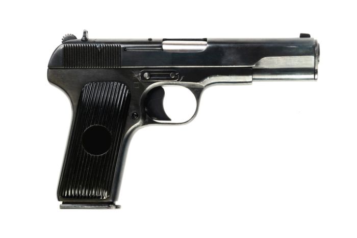 Close-Up Of Gun On White Background