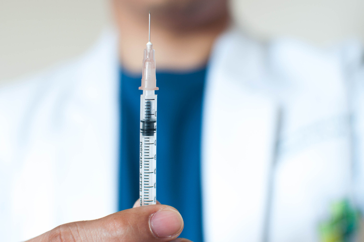 A doctor is ready to give a vaccination