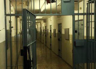 Open Gate At Corridor In Empty Prison