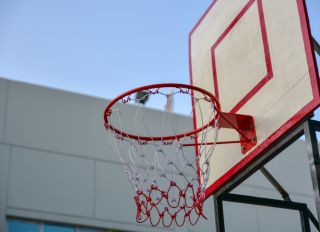 Low Angle View Of Basketball Hoop Against Clear Sky