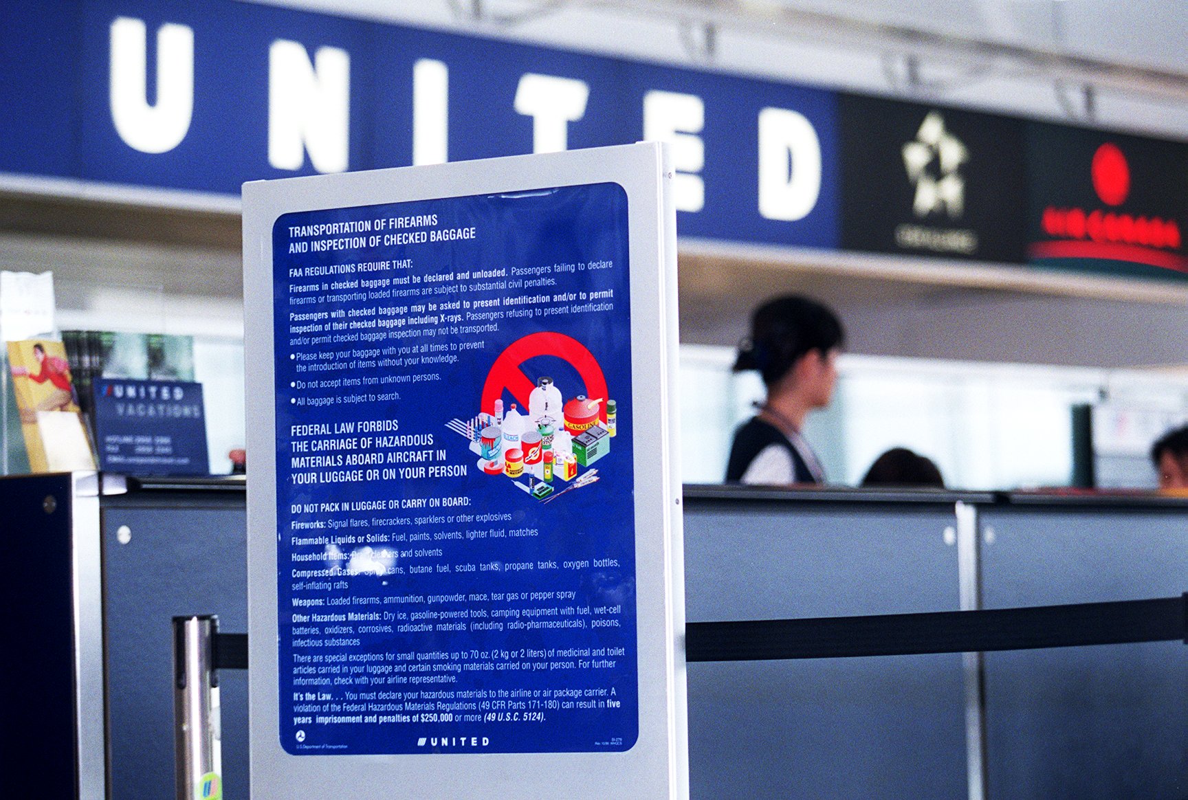 A sign explaining the new security measures at United Airlines counter in Chek Lap Kok as security is tightened after the terrorist attacks in New York and Washington.