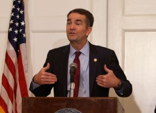 Governor Ralph Northam addresses the media the day after a photo of a person in Blackface and another dressed in a KKK uniform were discovered on his page in his medical school yearbook.