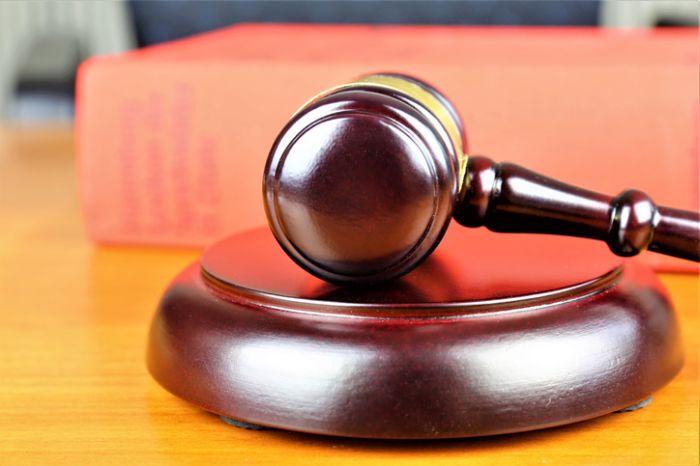 Close-Up Of Gavel On Table
