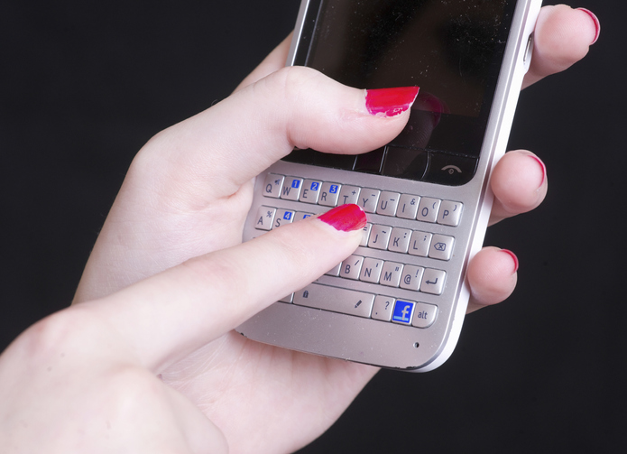 Young Woman Using Cell Phone, Close Up Of Hands