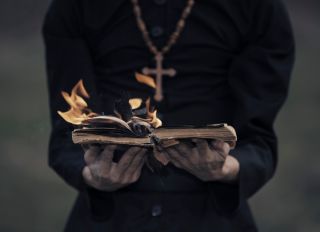 Exorcist with burning bible