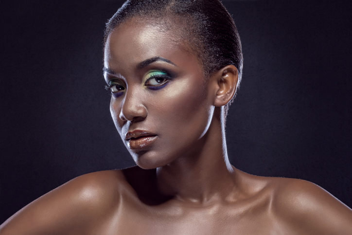 Beauty portrait of handsome ethnic African girl, on dark background