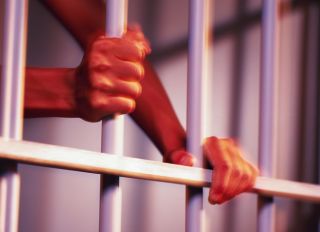 Prisoner Grips Cell Bars Motion