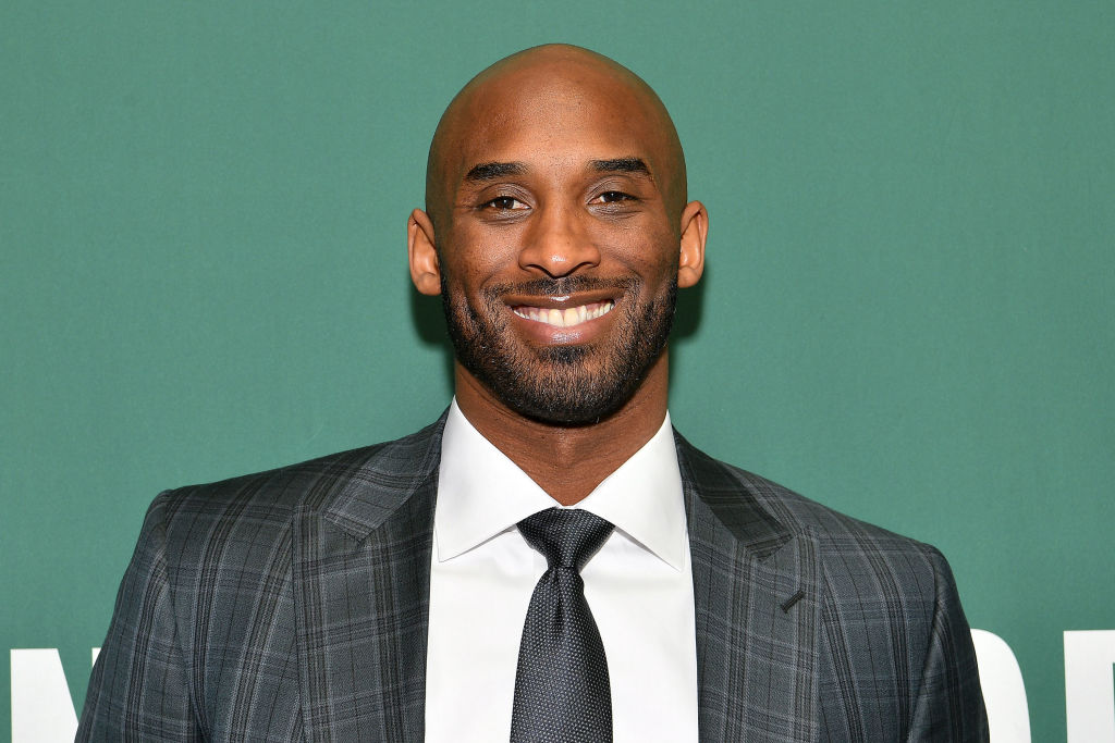 Kobe Bryant Signs Copies Of His Book 'Training Camp (The Wizenard Series #1)'