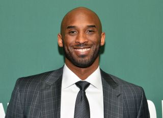 Kobe Bryant Signs Copies Of His Book 'Training Camp (The Wizenard Series #1)'