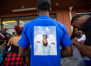 Fans Pay Respect At Scene Where Hip Hop Musician Nipsey Hussle Was Fatally Shot In Los Angeles
