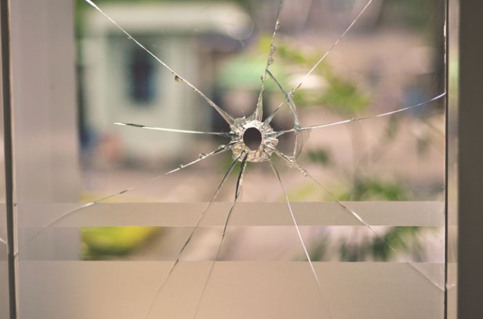 Bullet Hole on Glass Window