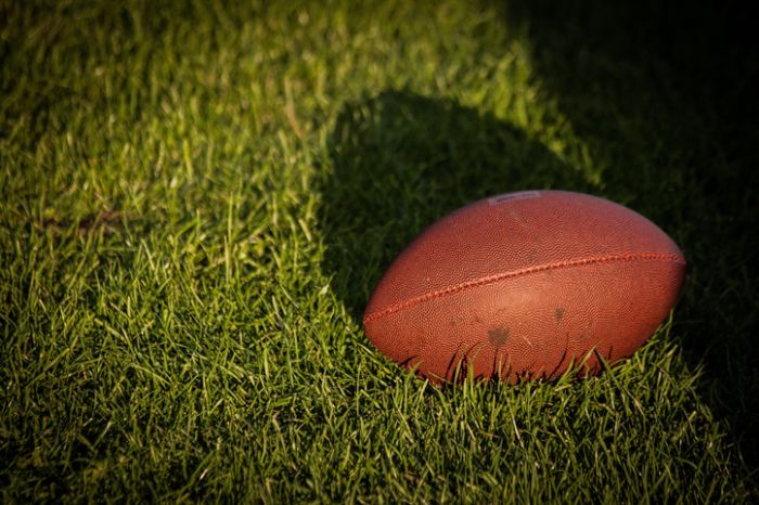 High Angle View Of American Football On Grassy Field