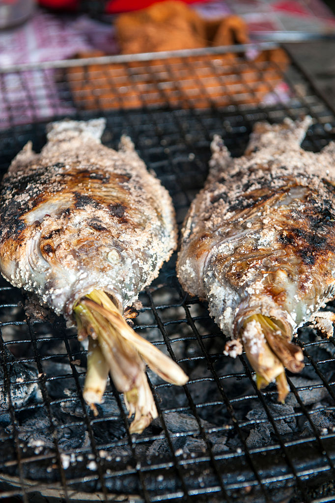Salt crusted Tilapia fish at a street stall in the Laos...