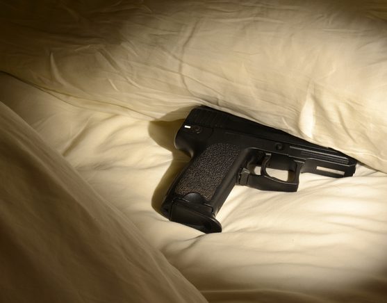 Handgun under pillow