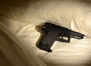 Handgun under pillow